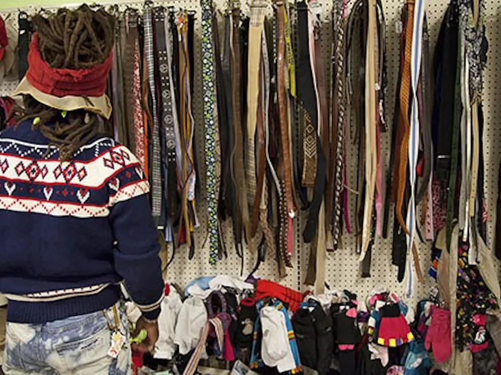 Algier Williamson searches among the shelves at Goodwill. Williamson goes thrift shopping almost every weekend for three hours at a time. DN PHOTO CHELSEA MEAD
