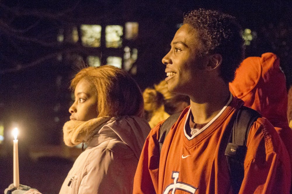 The University Green was lit up by a candle-lit vigil in solidarity with the protests in Ferguson, Mo. Around 25 people were in attendance at the Ethnic Theatre Alliance