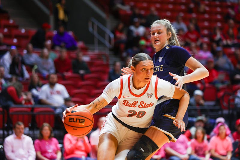 Senior Alex Richard glides the ball through the game against Kent State Feb. 22 at Worthen Arena. Richard has played 493 minutes this season. Kaylee Kern, DN