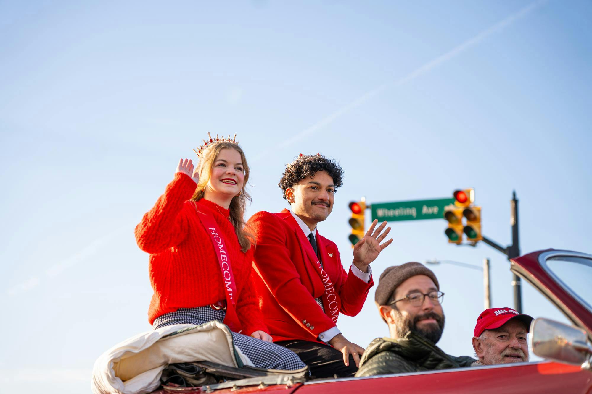 Ball State Homecoming royalty Brenna Large and Angel Esquivel Vazquez wave to the crowd Oct. 26 at Fallen Heroes Memorial Bridge. Ella Absher, DN