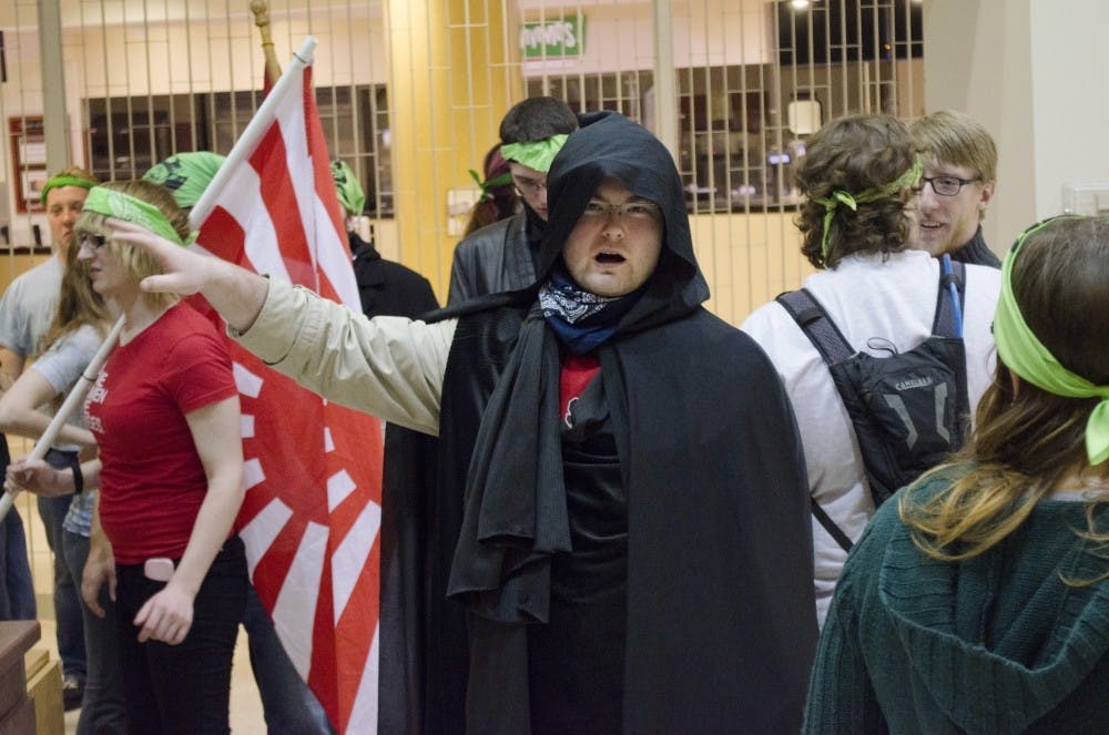 A zombie tells the fellow zombies to gather around an area to make a plan to attack the humans on March 24 at the Atrium. DN FILE PHOTO BREANNA DAUGHERTY