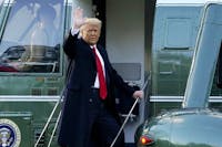 FILE - In this Wednesday, Jan. 20, 2021, file photo, President Donald Trump waves as he boards Marine One on the South Lawn of the White House, in Washington, en route to his Mar-a-Lago Florida Resort. Former President Trump has named two lawyers to his impeachment defense team, one day after it was revealed that the former president had parted ways with an earlier set of attorneys. (AP Photo/Alex Brandon, File)