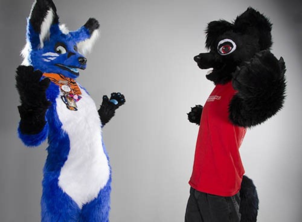 Members of the Ball State Anthropomorphic Society Seneca (left) and Pom are just two of roughly 30 active members. The group has members ranging from artists, to fursuiters, to people interested in learning more about the fandom. DN PHOTO COREY OHLENKAMP
