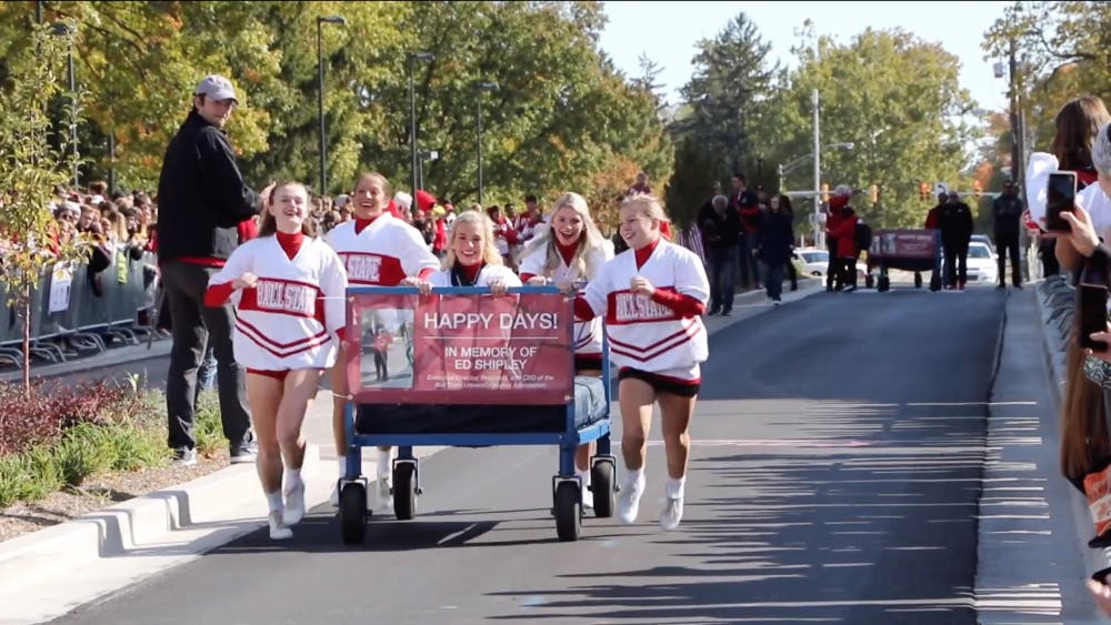 The Ball State Cheerleaders push their bed across the finish during the annual Ball State Bed Race in 2019