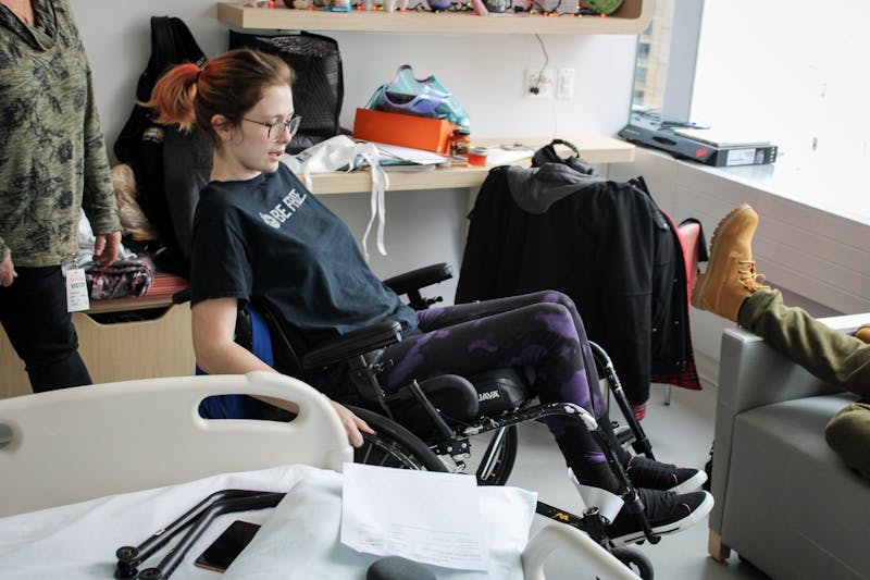 Jessica Vanhook shows off her new skills in a wheelchair after her family arrived for a visit at Shirley Ryan Ability Lab in Chicago, Nov. 2, 2019. Vanhook is currently going through physical therapy and learning to adapt to a new lifestyle. Josh Smith, DN