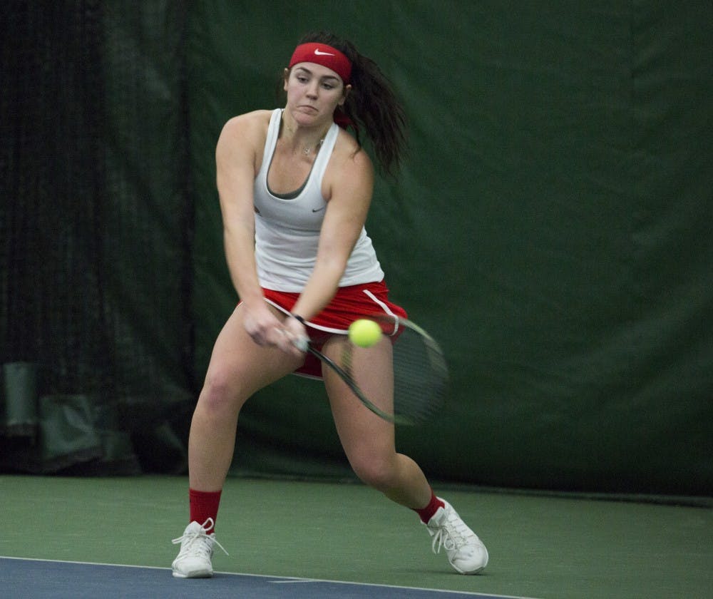 Sophomore Isabelle Dohanics reacts after winning a point during her singles match against Wright State on Feb. 5. Emma Rogers // DN