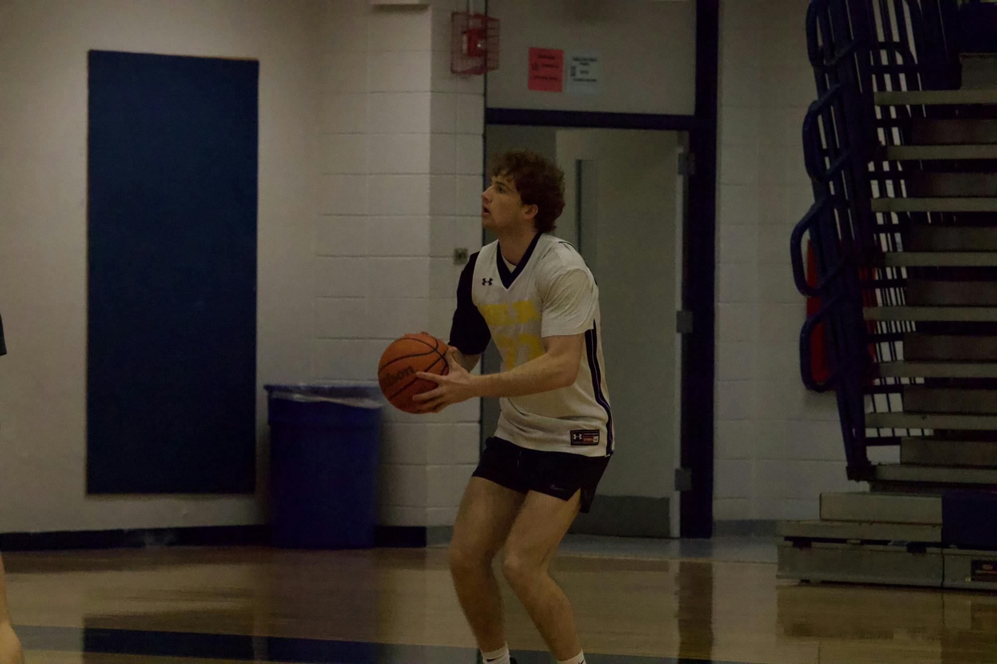 Delta junior Jackson Wors shoots a three point shot during practice Mar. 1 at Delta High School in Muncie, Ind. Zach Carter, DN
