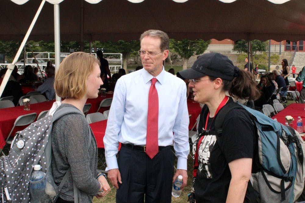 President Mearns speaks with people on Sept. 8 in LaFollette Field for President Mearns Installation Picnic. The picnic was open to the public.  Andrew Smith, DN