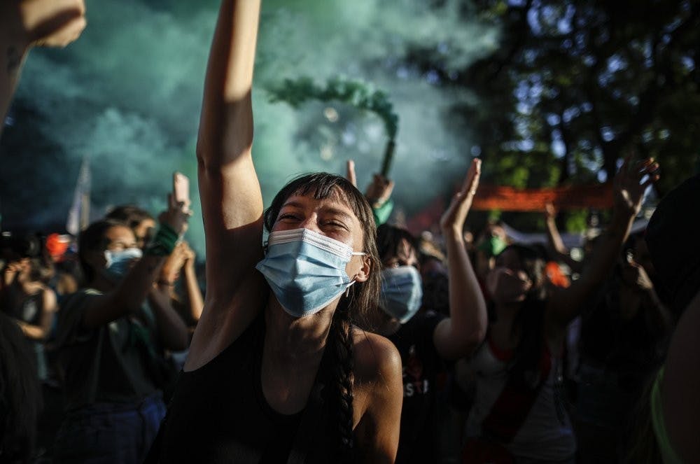 Abortion-rights activists participate in a demonstration for the decriminalization of abortion, outside Congress as lawmakers debate a bill on its legalization, in Buenos Aires, Argentina, Thursday, Dec. 10, 2020. (AP Photo/Natacha Pisarenko)