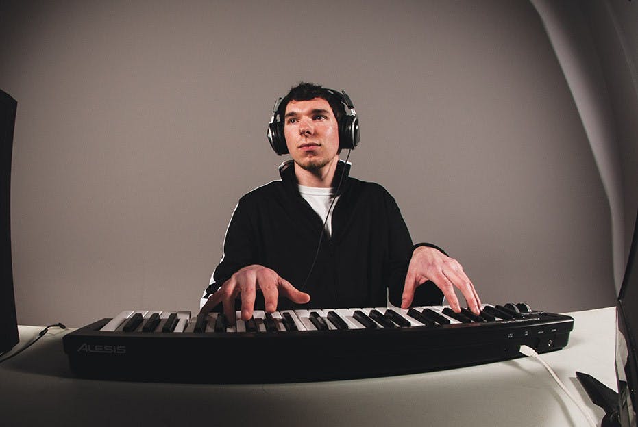 Sophomore Sebastian Gardenhire poses with his computer and keyboard. DN PHOTO ILLUSTRATION BOBBY ELLIS
