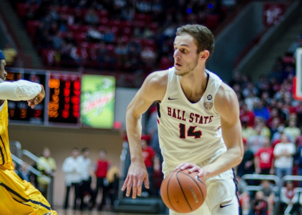 <p>Sophomore forward Kyle Mallers runs the ball down the court passing his Kent State opponent Feb. 9 at John E. Worthen Arena. Ball State wins the game 87-68. <strong>Stephanie Amador, DN</strong></p>