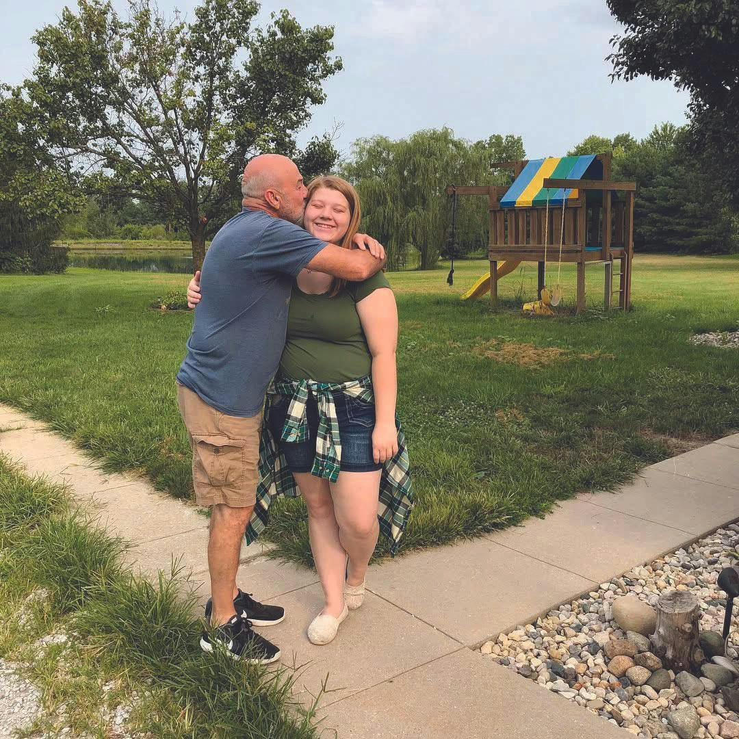 Mike kisses Emmett goodbye before leaving for college in 2018. Emmett Bartholomew, photo provided. 