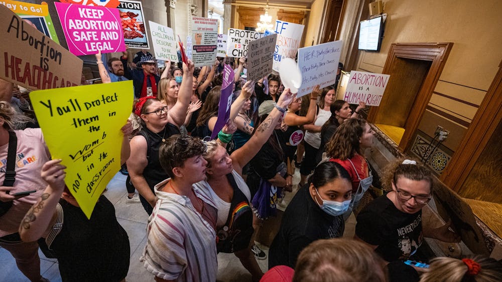 Abortion-rights protesters chant during a session of the Indiana state Senate at the Capitol on July 25, 2022 in Indianapolis. The legislature held a special session to consider curtailing abortion rights in the wake of the U.S. Supreme Court ruling overturning Roe v. Wade last month. (Jon Cherry/Getty Images/TNS)