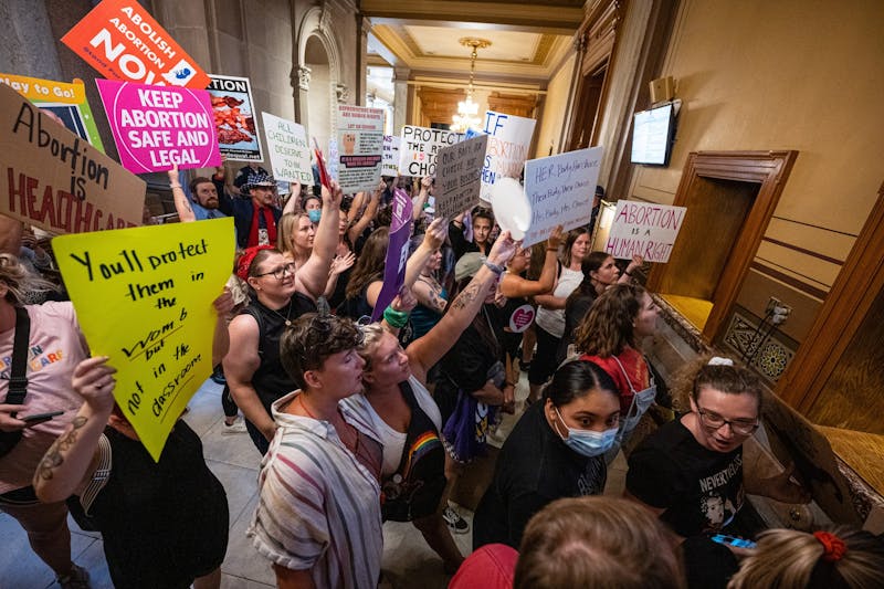 Abortion-rights protesters chant during a session of the Indiana state Senate at the Capitol on July 25, 2022 in Indianapolis. The legislature held a special session to consider curtailing abortion rights in the wake of the U.S. Supreme Court ruling overturning Roe v. Wade last month. (Jon Cherry/Getty Images/TNS)