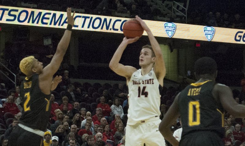 Ball State guard Kyle Mallers shoots over a Kent State defender during the Mid-American Conference Tournament quarterfinals. Robby General, DN