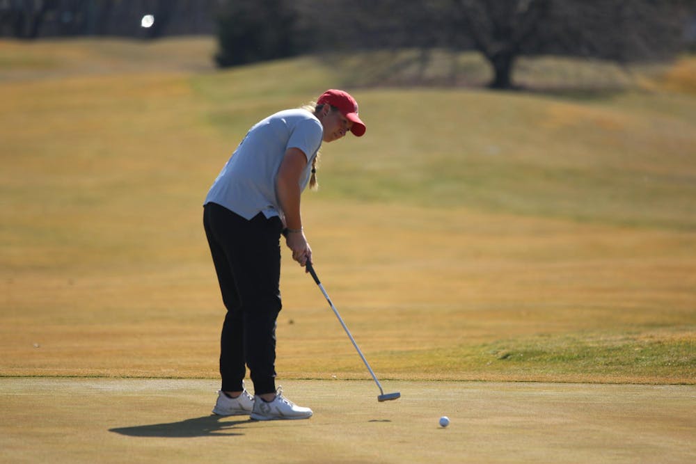 Sophomore Madelin Boyd putts Feb. 26 during a practice round at The Players Club at Woodland Trails. Zach Carter, DN.