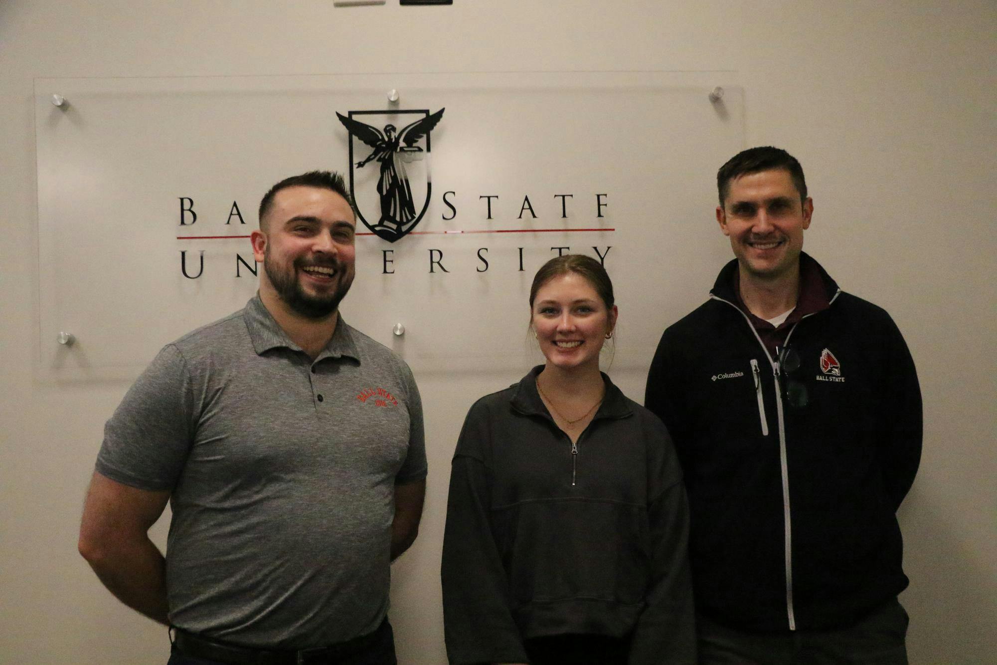 Ball State University's Financial Wellness advisors Evan Richter (left) and Jon Mock (right) pose for a photo in their department office with financial peer mentor student Eva Bott Jan. 22. Richter said he started the department's latest financial advising program two years ago. Shelby Anderson, DN