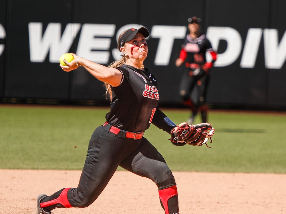 Sophomore utility McKenna Mulholland throws the ball to first after a hit against Bowling Green April 13 at First Merchants Ballpark Complex. Mulholland had three assists in the game. Andrew Berger, DN