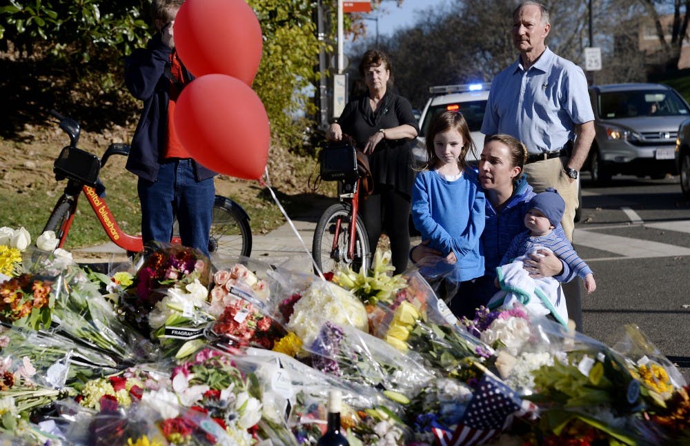 Signs and messages of support have been left at a memorial for the victims of the Paris terror attacks at the Embassy of France in Washington, D.C., on Sunday, Nov. 15, 2015. People gathered in cities around the world to show support for Paris following the coordinated assault that left at least 129 people dead and over 350 injured. (Olivier Douliery/Abaca Press/TNS)