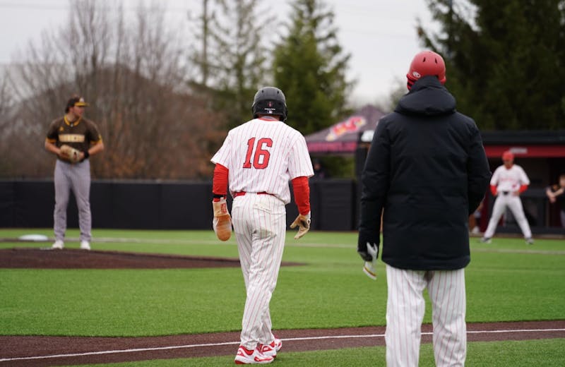 Ball State Baseball head Coach, Rich Maloney, looks on as his team is on offense.