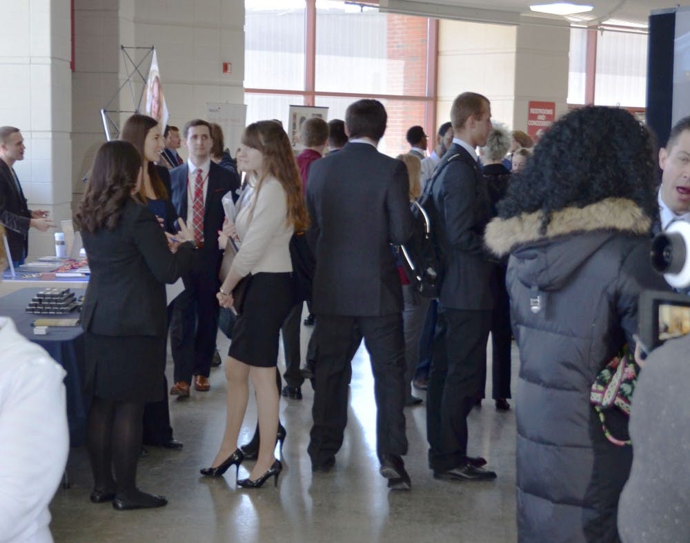 	Students connect with employers at the Cardinal Job Fair on Feb. 12 in Worthen Arena. Students could meet with 106 different company representatives. 