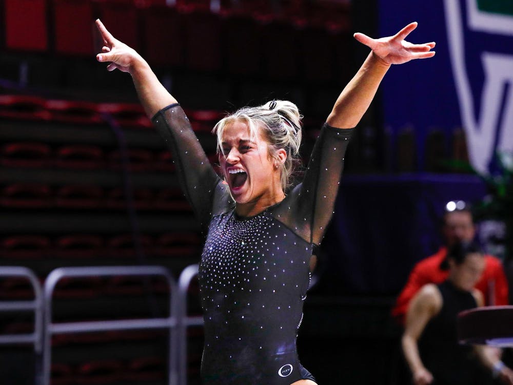 Graduate student all-around Megan Teter lands her vault jump March 23 at the Mid-American Championship at Worthen Arena. Teter scored 9.850 on vault. Andrew Berger, DN