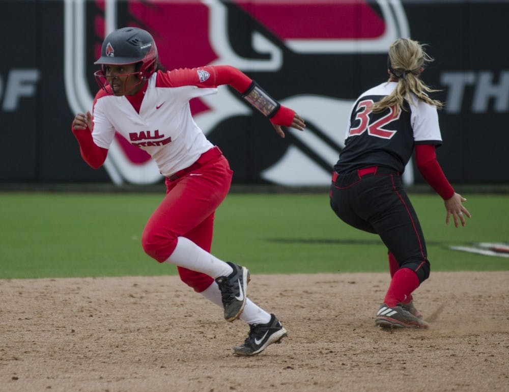 Junior pinch runner Aeshia Miles runs to third base during the second game of the double-header against Northern Illinois on April 4 at the Softball Field at the First Merchants Ballpark Complex. Ball State won the first game 3-2 and the second game 6-4. Emma Rogers, DN File