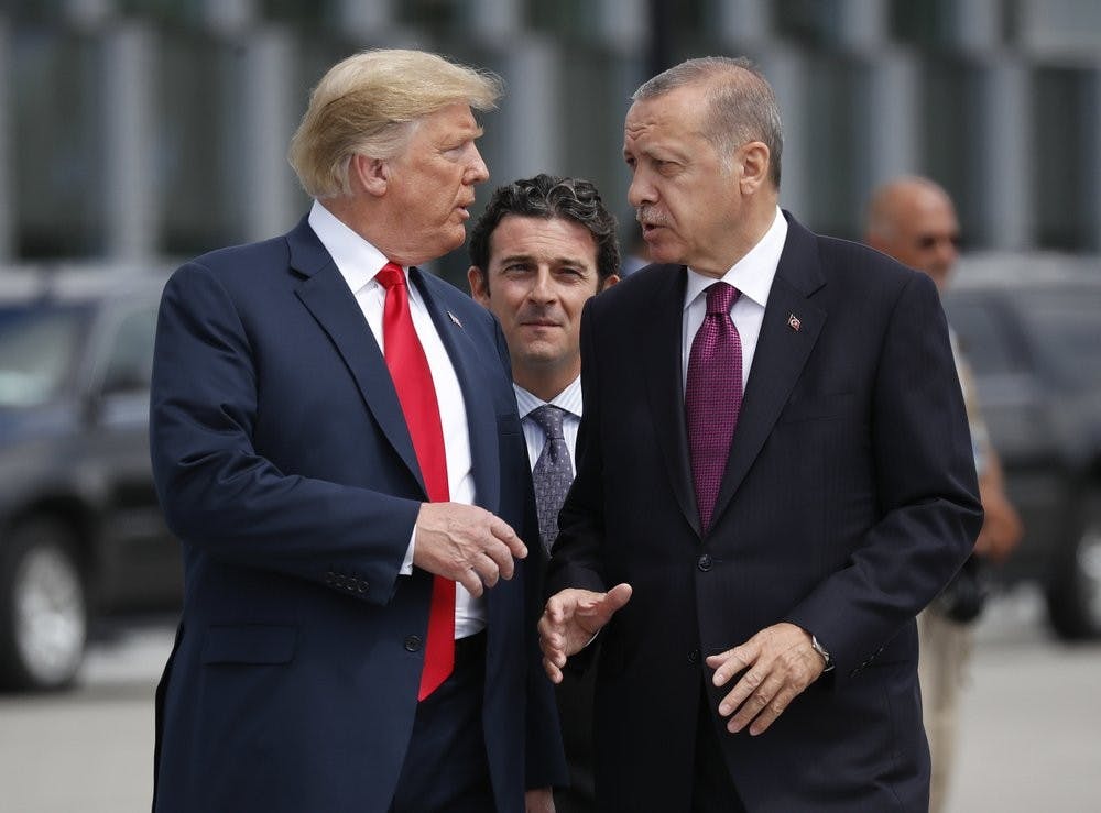 <p>FILE - In this Wednesday, July 11, 2018, file photo, President Donald Trump, left, talks with Turkey's President Recep Tayyip Erdogan, as they arrive together for a family photo at a summit of heads of state and government at NATO headquarters in Brussels. The White House says Turkey will soon invade Northern Syria, casting uncertainty on the fate of the Kurdish fighters allied with the U.S. against in a campaign against the Islamic State group. <strong>(AP Photo/Pablo Martinez Monsivais, File)</strong></p>