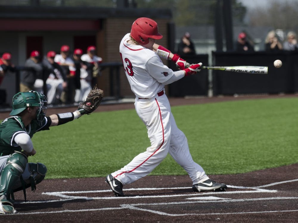 Sophomore catcher Griffin Hulecki hits the ball during the game against Ohio University on April 2 at the First Merchants Ballpark Complex. Ball State lost 10-0, bringing the Cardinals losing streak to eight games in a row. Emma Rogers // DN