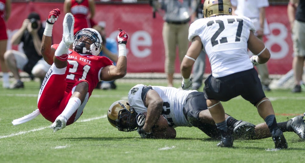 Safety Martez Hester takes a tumble after tackling the running back during the Army game on Sept. 7, 2013. Hester will playfor the Cardinals in light of the injury of Dae
