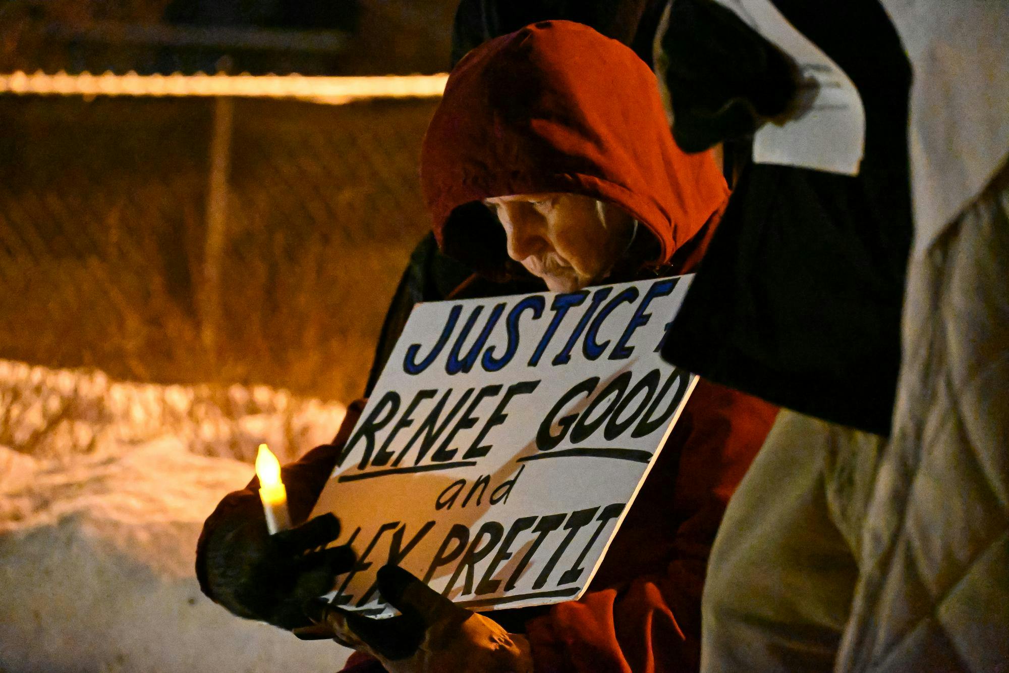 Muncie resident Karen holds a sign in support of ICE victims on Feb. 6 at the Peace Plaza. Ayslin Bowman, DN