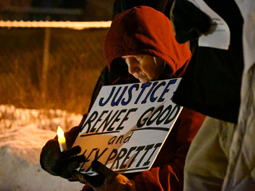 Muncie resident Karen holds a sign in support of ICE victims on Feb. 6 at the Peace Plaza. Ayslin Bowman, DN