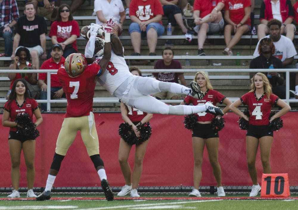 Senior wide receiver Jordan Williams attempts to catch the ball during the game against Virginia Military Institute on Sept. 3 at Scheumann Stadium. The catch was ruled incomplete. DN PHOTO BREANNA DAUGHERTY