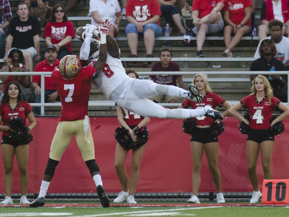 Senior wide receiver Jordan Williams attempts to catch the ball during the game against Virginia Military Institute on Sept. 3 at Scheumann Stadium. The catch was ruled incomplete. DN PHOTO BREANNA DAUGHERTY