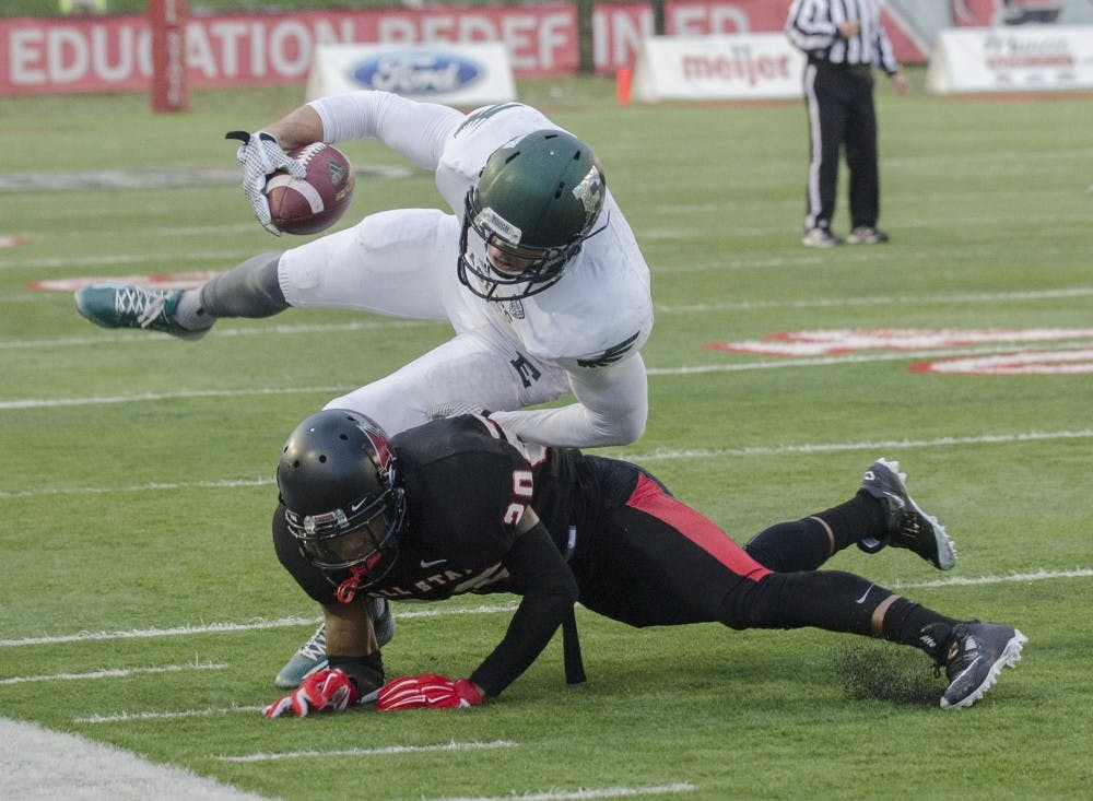 Sophomore cornerback Darius Conaway attempts to stop a play during the game against Eastern Michigan on Nov. 22 at Scheumann Stadium. DN PHOTO BREANNA DAUGHERTY