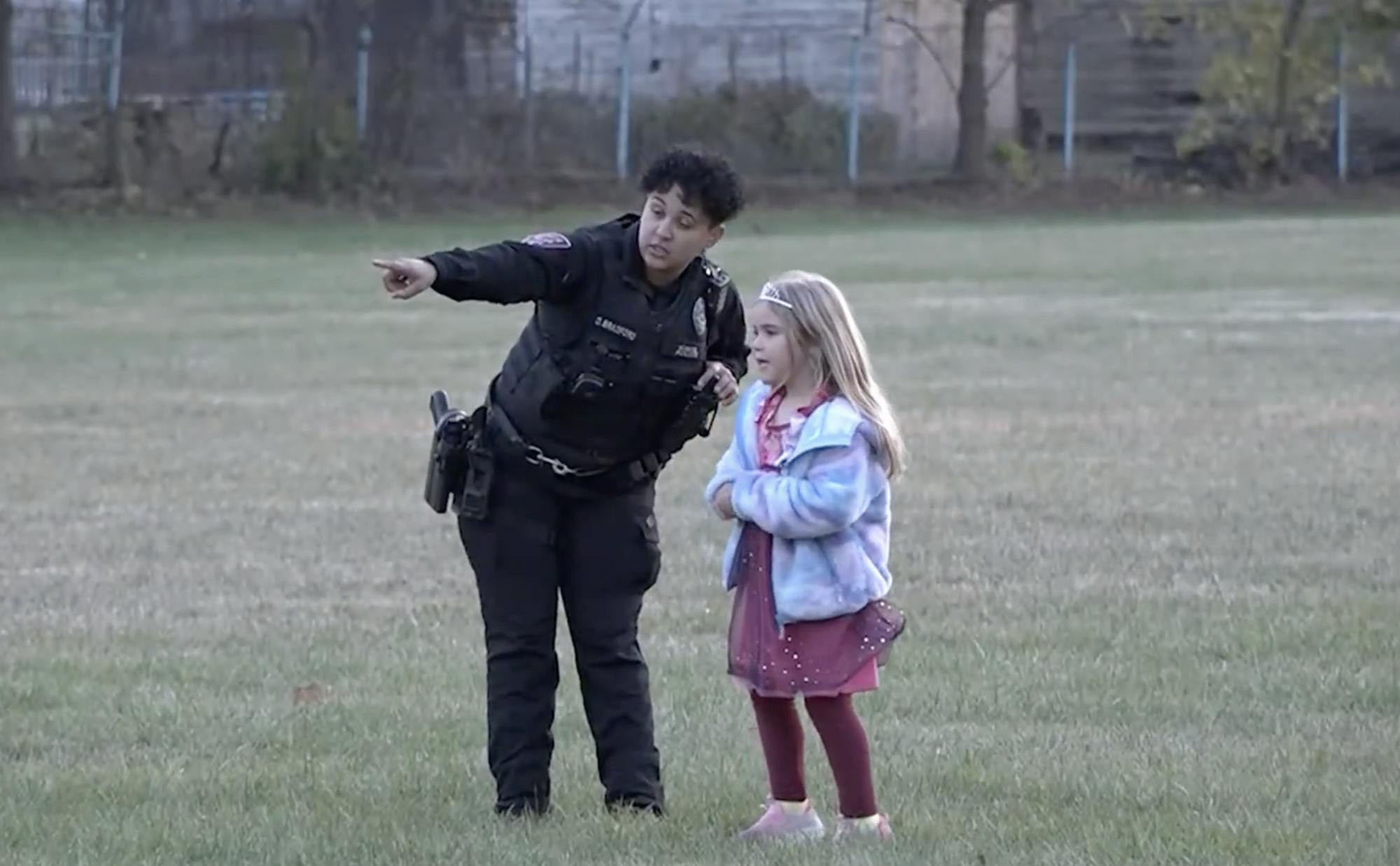A Muncie police officer points a girl to the next base in a game of kickball.

Tatum Harris, NewsLink Indiana