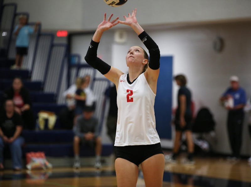 Wapahani junior Kami Rivers sets Aug. 21 during a match against Delta at Delta High School. Wapahani won after five sets. Zach Carter, DN.