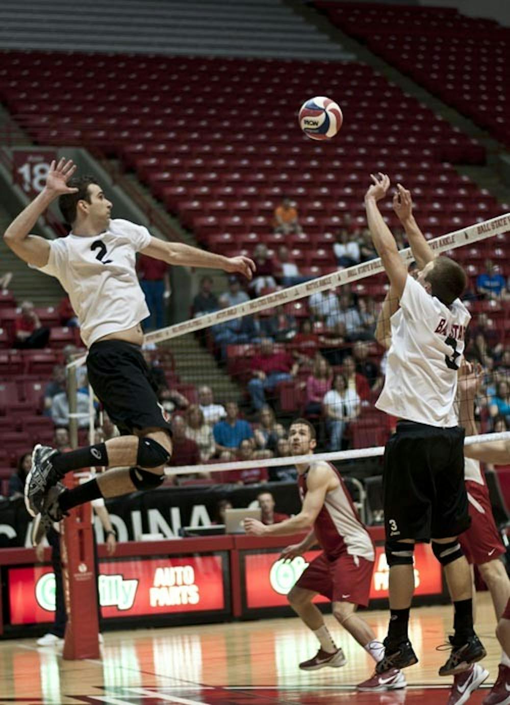 Matt Leske, left, receives the set from Dan Wichmann on March 18, 2012 during a match against Ohio State. Ball State’s men’s volleyball team will play its season opener Saturday against St. Francis. DN FILE PHOTO JONATHAN MIKSANEK