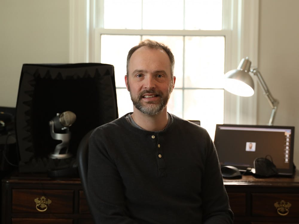 Associate Professor of Spanish Stephen Hessel poses for a photo in his podcast studio Feb. 15 near Jackson Street. Hessel had the idea for "Pod Quixote" during the COVID-19 pandemic and released his first episode Aug. 16, 2021. Rylan Capper, DN