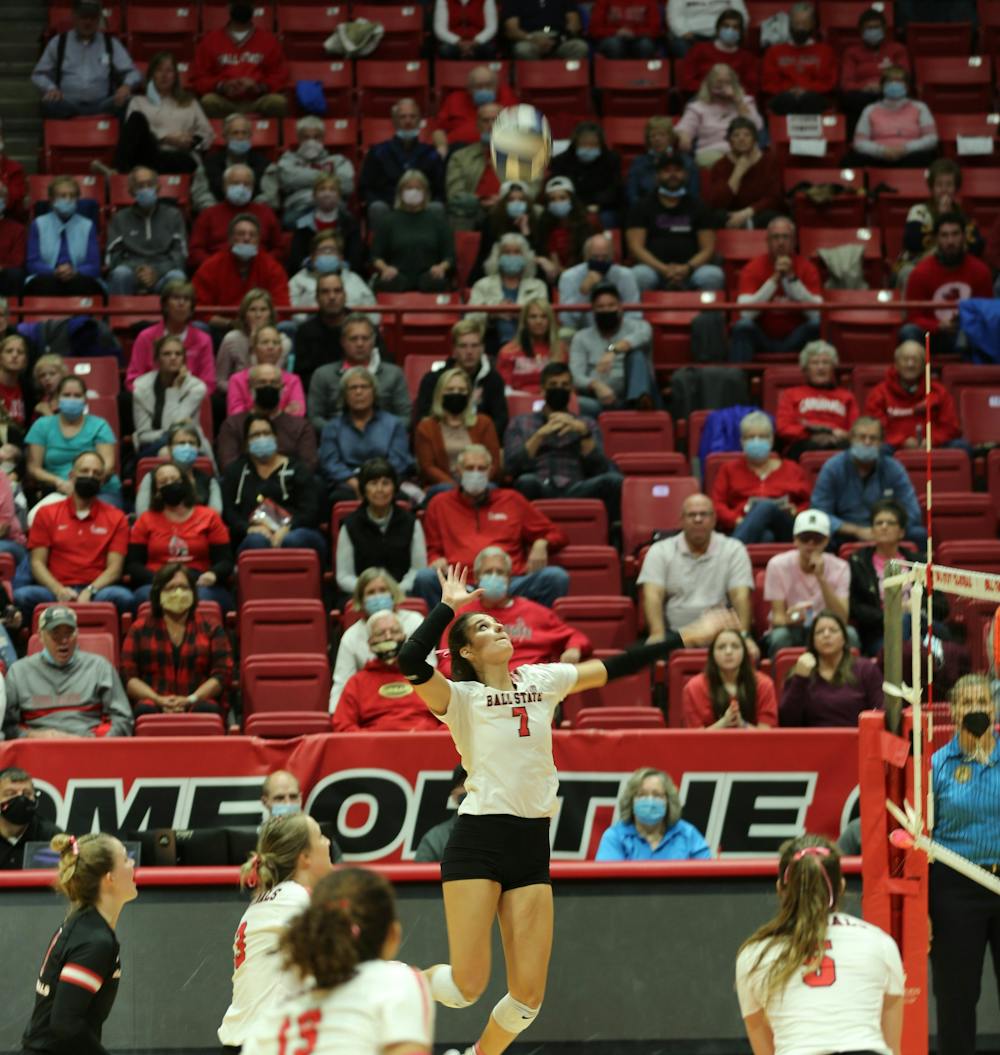 <p>Ball State junior Natalie Risi jumps to hit the ball on Oct. 29 at Worthen Arena. Risi led the Cardinals in kills with 12 on the night. Eli Houser, DN</p>