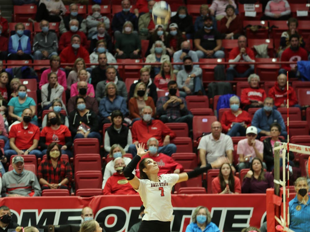 Ball State junior Natalie Risi jumps to hit the ball on Oct. 29 at Worthen Arena. Risi led the Cardinals in kills with 12 on the night. Eli Houser, DN