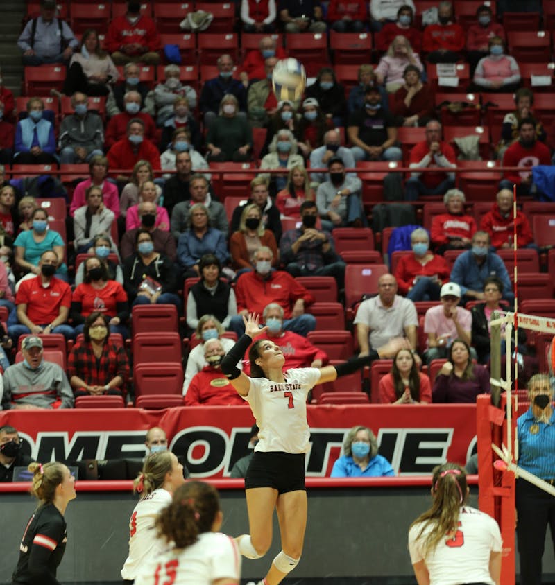 Ball State junior Natalie Risi jumps to hit the ball on Oct. 29 at Worthen Arena. Risi led the Cardinals in kills with 12 on the night. Eli Houser, DN