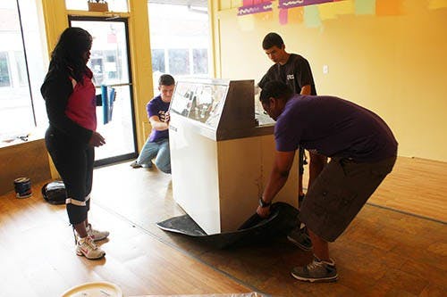 Jeannine Lee Lake, owner of Grandma Betty’s, supervises as the ice cream cooler is brought into the new location. Lake’s son Charles helped with the lifting, along with Marc Paraira Gimenez and Adam Byers. DN KRYSTAL BYERS