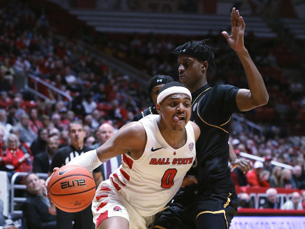 Redshirt-junior guard Jarron Coleman dribbles the ball toward the net in a game against Kent State Feb. 21 at Worthen Arena. Coleman had eight assists during the game. Amber Pietz, DN