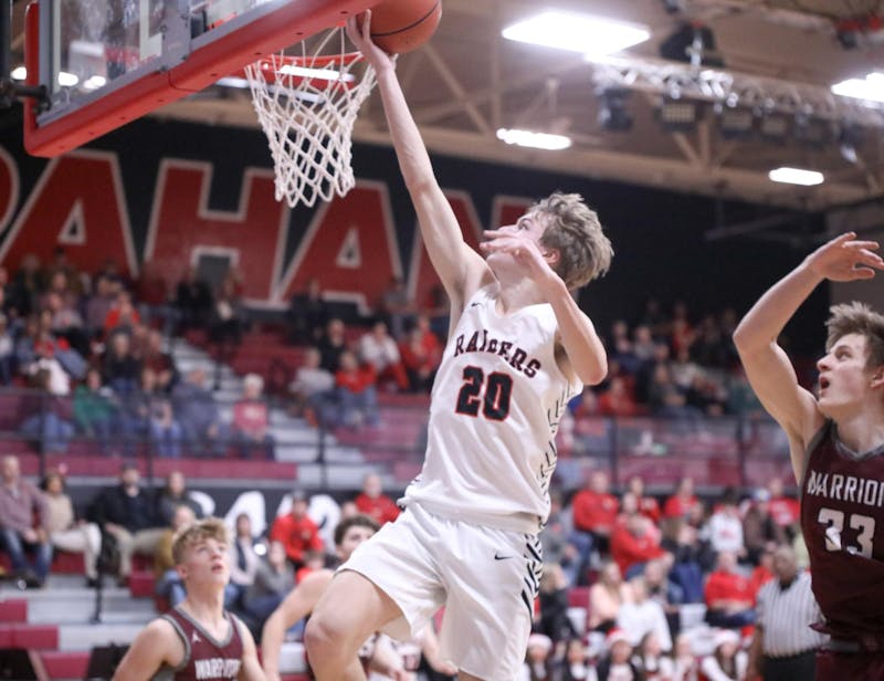 Wapahani senior Eli Andrews attempts a layup Dec. 20 against Wes-Del at Wapahani High School. Wapahani defeated Wes-Del 74-35. Zach Carter, DN.