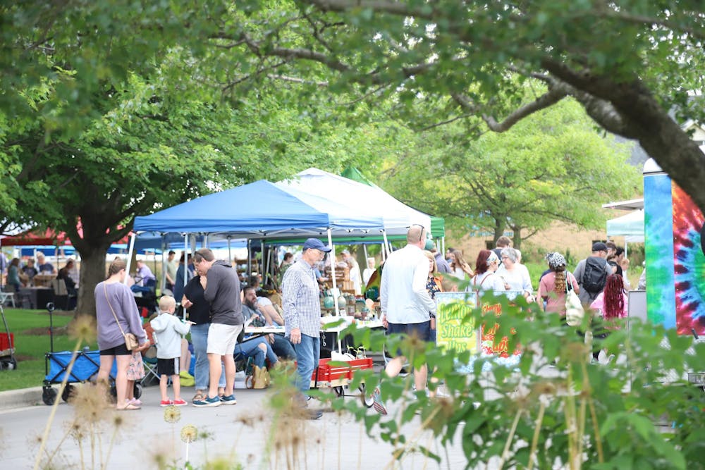 Community members gather at the farmers market June 8 at the Minnetrista Museum and Gardens in Muncie. The farmers market takes place weekly from 9 A.M. to 12 P.M. Olivia Gronud, DN