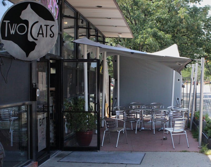 Owner of Two Cats Café, Bassam Helwani, has added a few things since it opened a year and a half ago. Alcohol, live music and a chef are just a few of Helwani's new additions. Andrew Smith, DN File