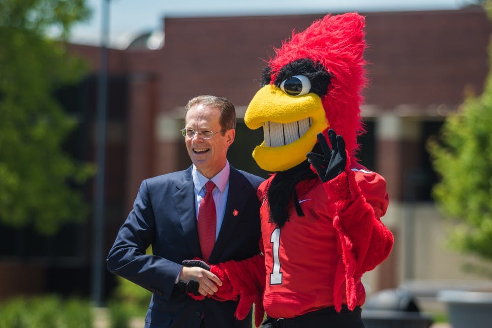 <p>Geoffrey S. Mearns meets Charlie Cardinal during a tour of campus on first day as Ball State's 17th president. Reagan Allen // DN</p>
