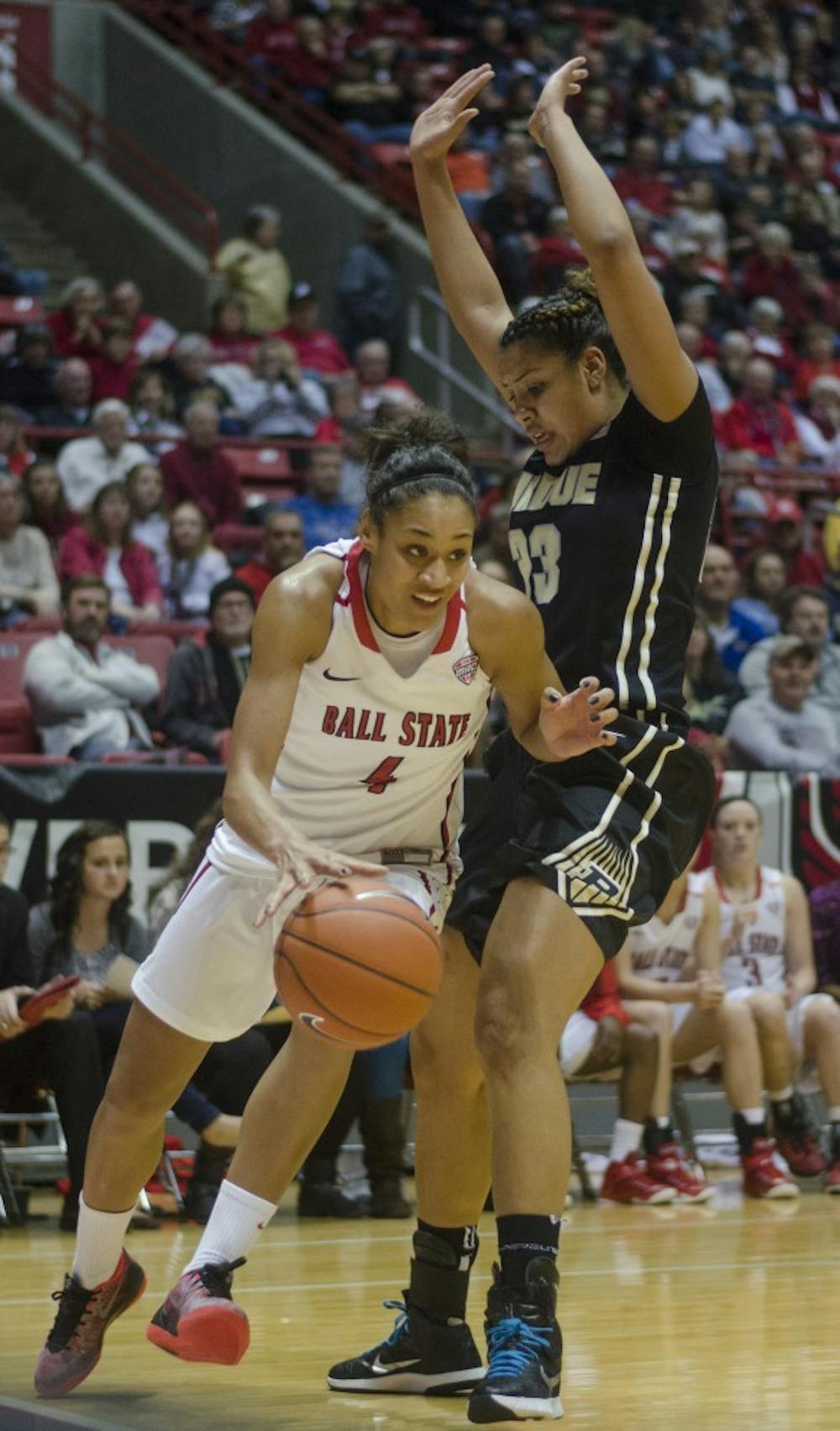 Junior guard Nathalie Fontaine attempts to dribble past a Purdue player during the game on Nov. 14 at Worthen Arena. DN PHOTO BREANNA DAUGHERTY