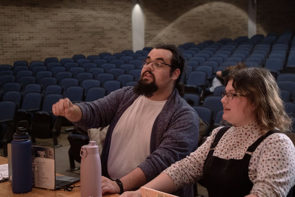 David Hreno (left) and Megan Templeton (right) give actors notes and pointers during rehearsal April 3. They try to help the middle school cast envision the same interactions they are and give them the acting skills to express those interactions. Miguel Naranjo, DN